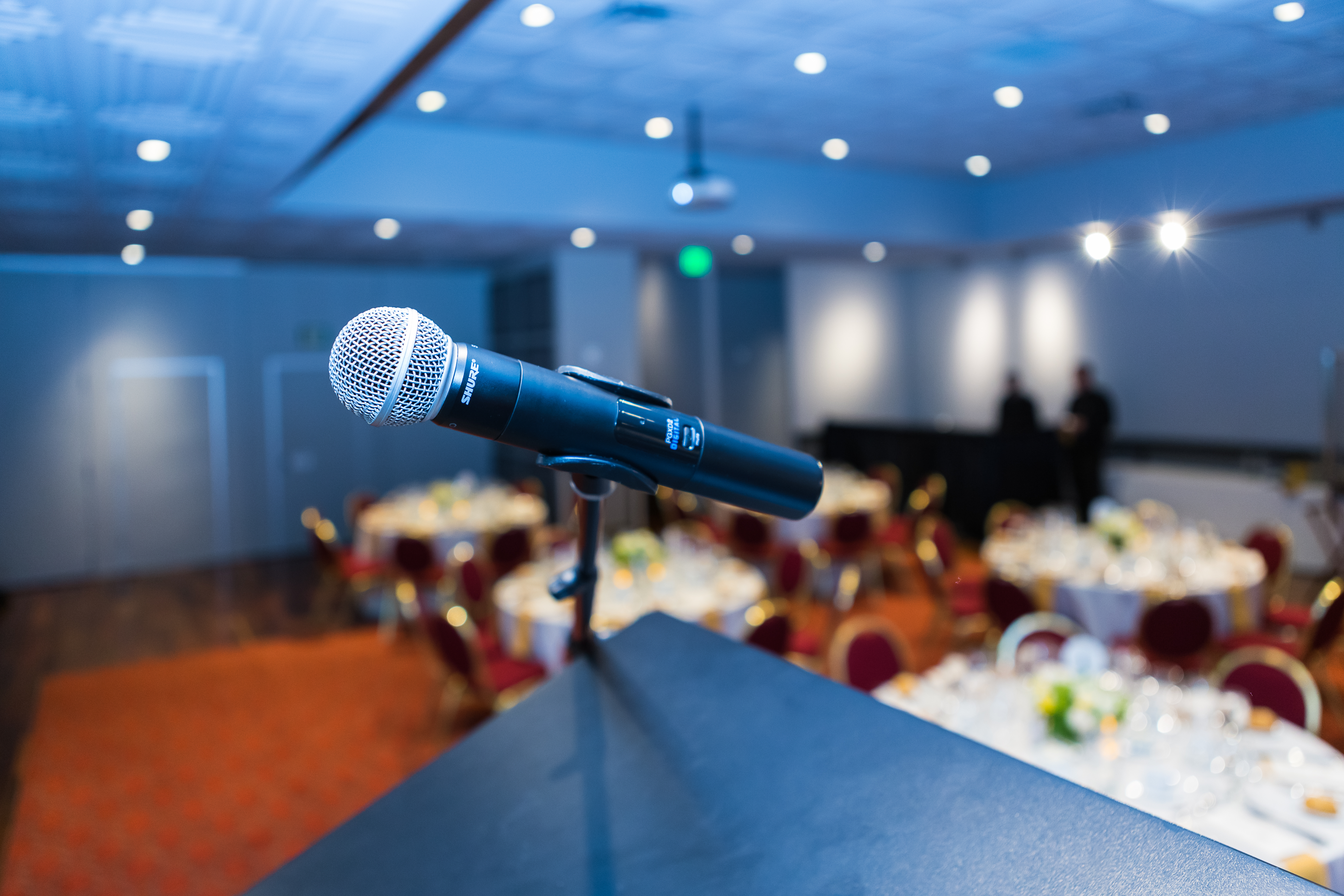 microphone awaits speakers at the merchants exchange club